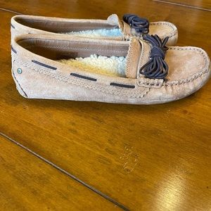 UGG tan shearling lined driving mocs. Dark brown lacing. Excellent condition.